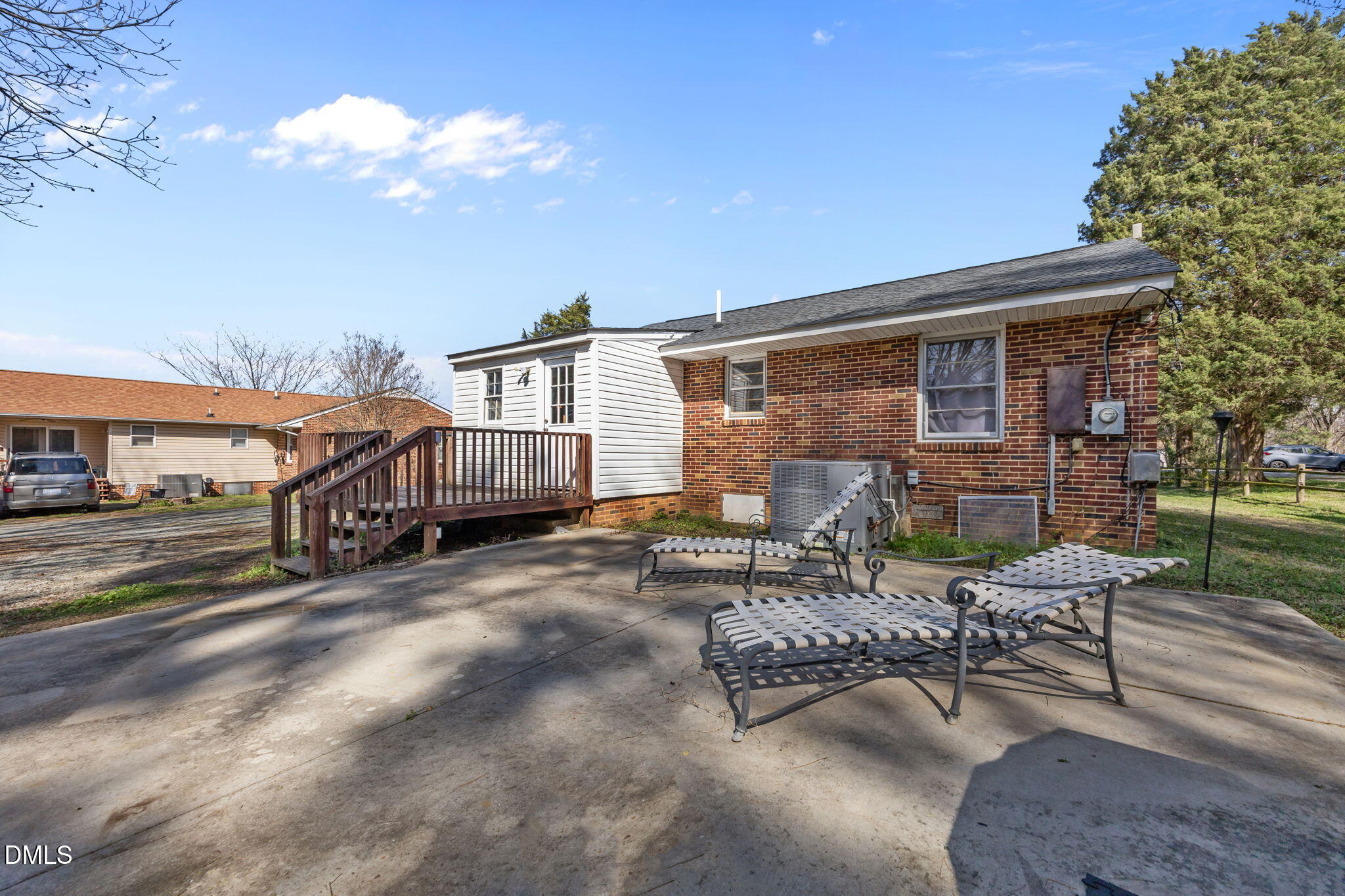2727 Highway 87 Graham, NC 27253 - Photo 27 of 28 a wooden bench sitting in front of a building