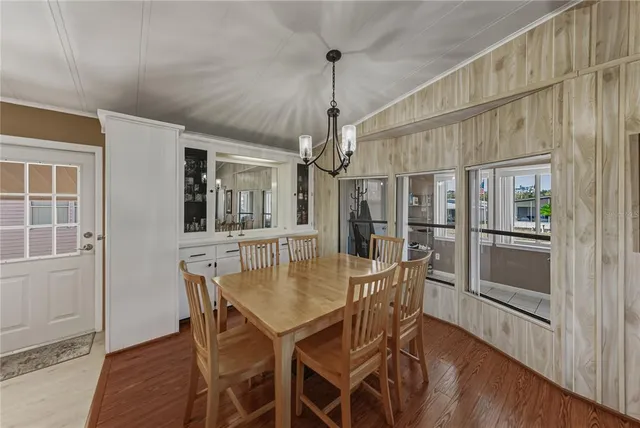 a view of a dining room with furniture and window