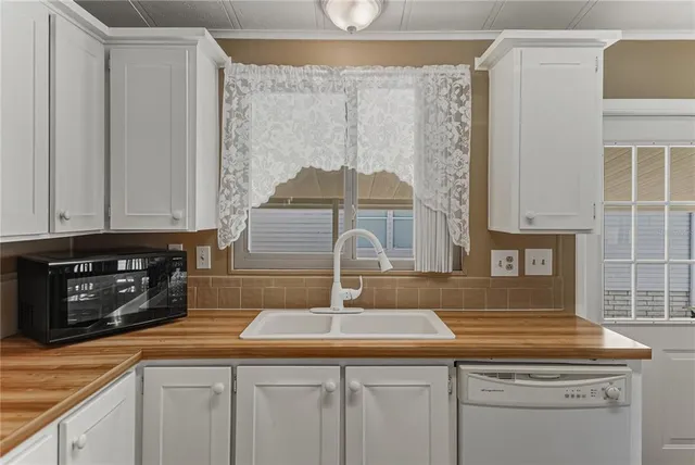 a kitchen with a sink and cabinets