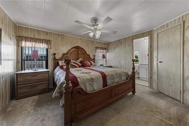 a bed room with a bed and a chandelier