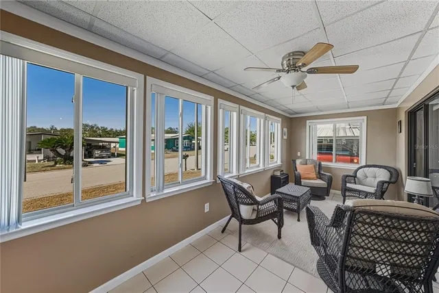 a view of a dining room with furniture window and outside view