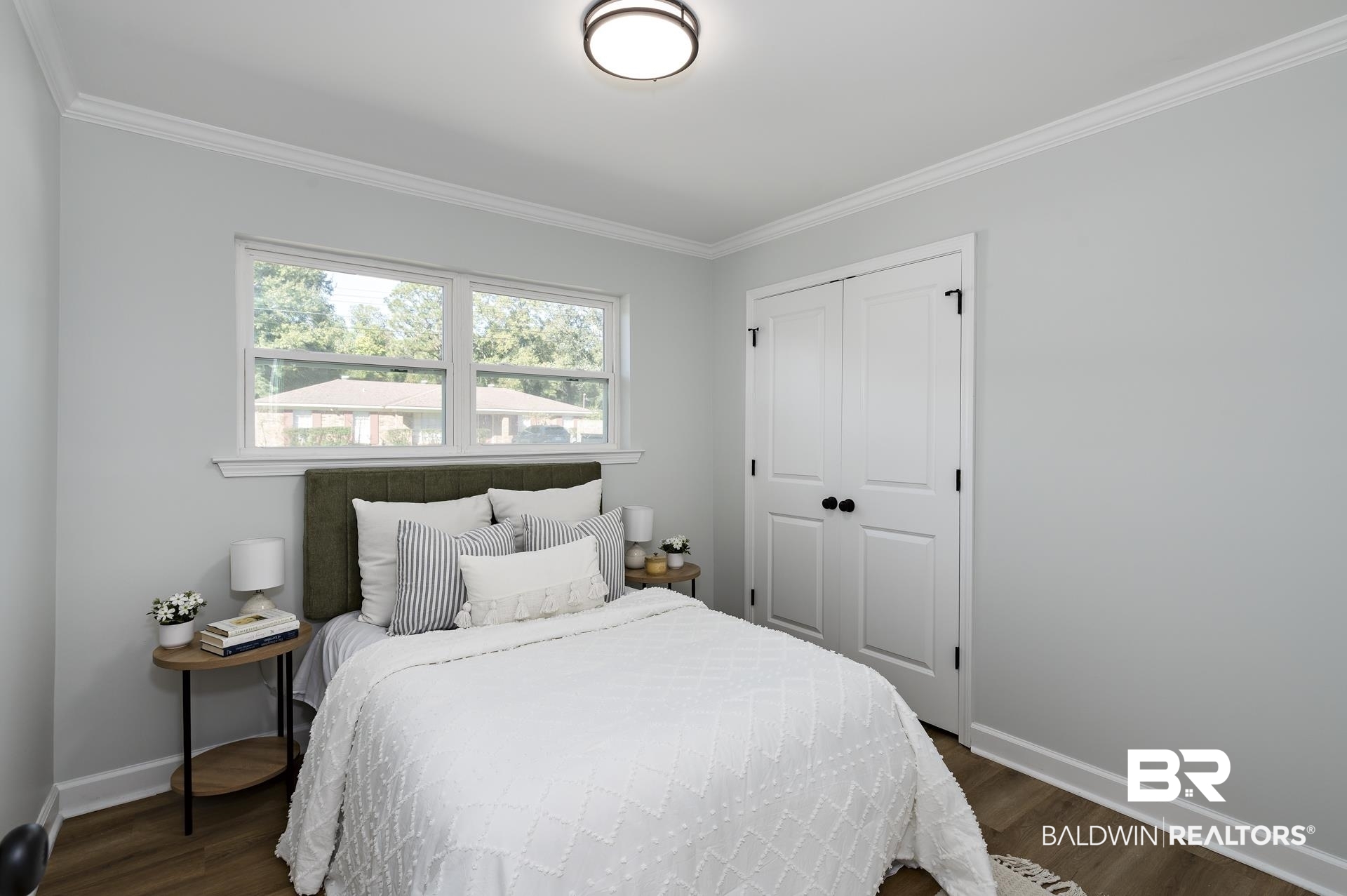 6001 Camp Halls Mill Road Mobile, AL 36619 - Photo 29 of 52 Bedroom featuring ornamental molding, dark wood-style flooring, and a closet