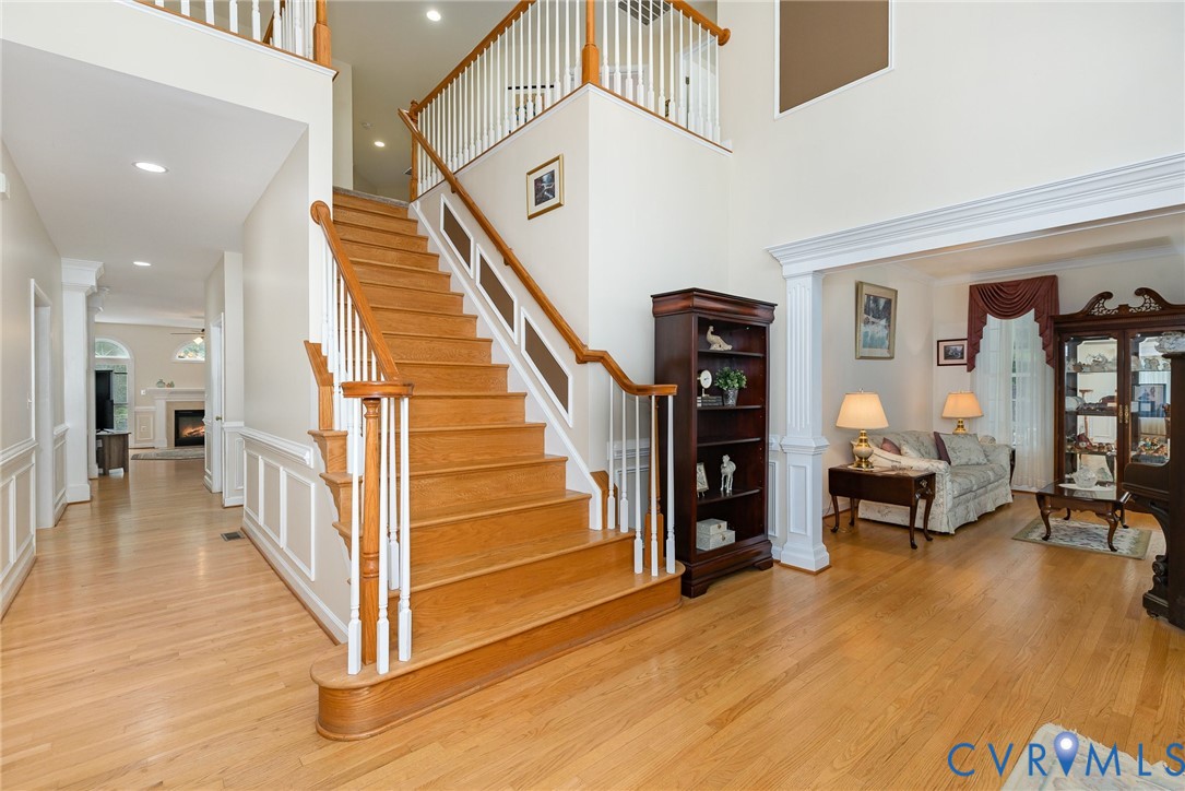 160 Walnut Ridge Drive Stafford, VA 22556 - Photo 5 of 43 Stairs with a lit fireplace, wood finished floors,