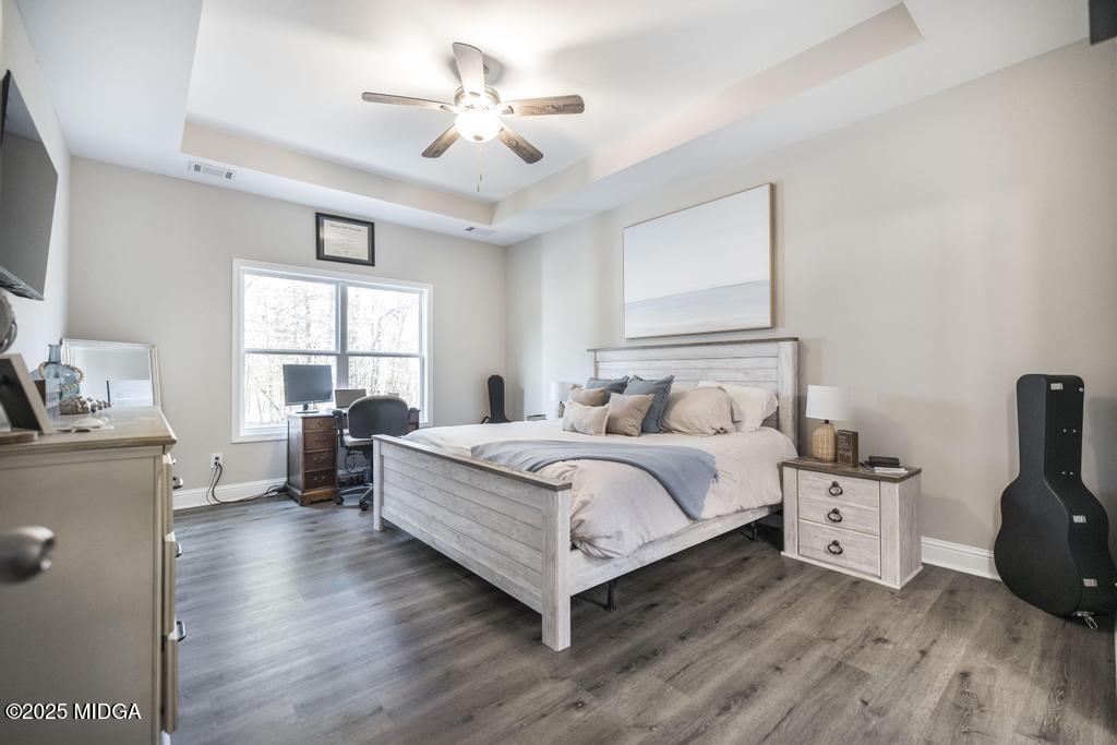 219 Diamond Place Gray, GA 31032 - Photo 10 of 42 a spacious bedroom with a bed and a window