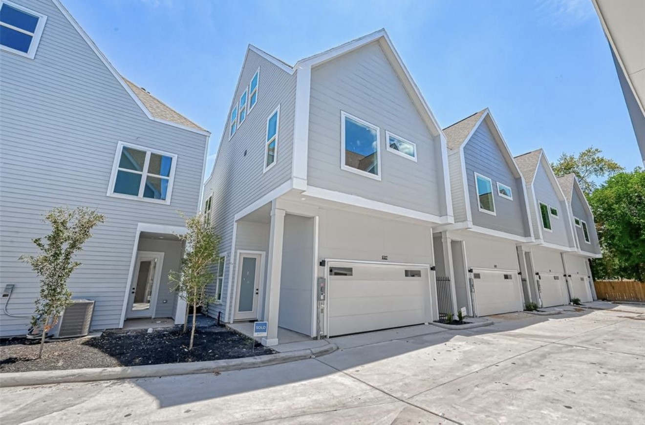 a front view of a house with yard