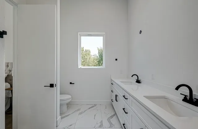 a bathroom with a sink and toilet