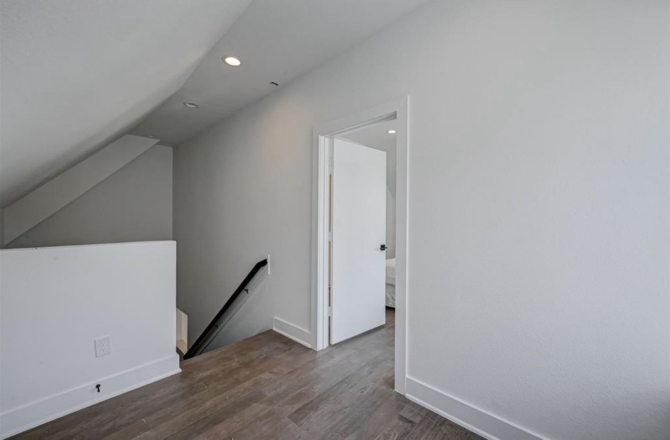 6127 West Montgomery Road Houston, TX 77091 - Photo 31 of 38 a view of a hallway with wooden floor