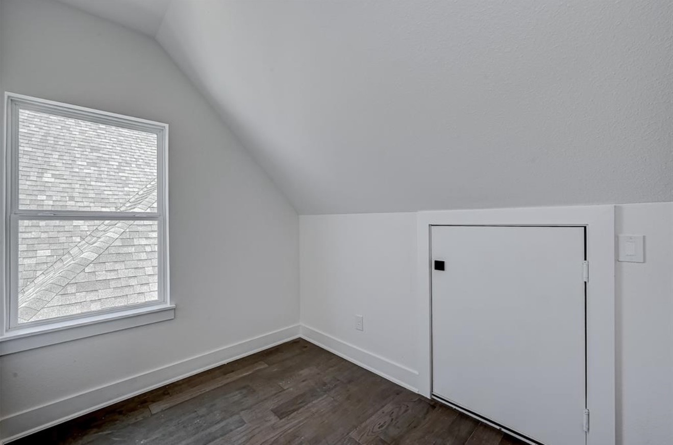 6127 West Montgomery Road Houston, TX 77091 - Photo 32 of 38 a view of an empty room with wooden floor and a window