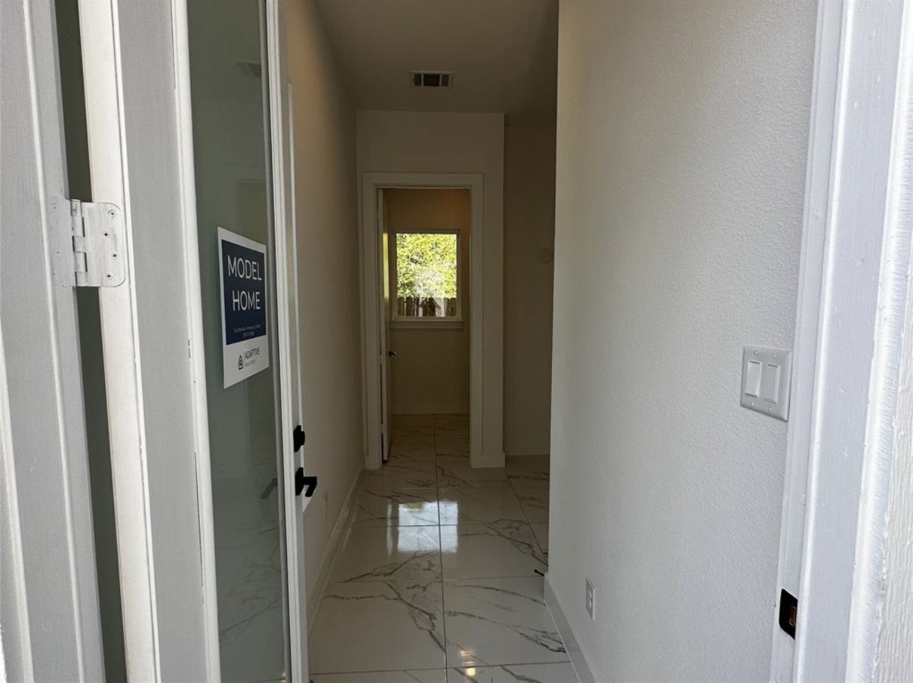 6127 West Montgomery Road Houston, TX 77091 - Photo 4 of 38 a view of a bathroom from a corridor