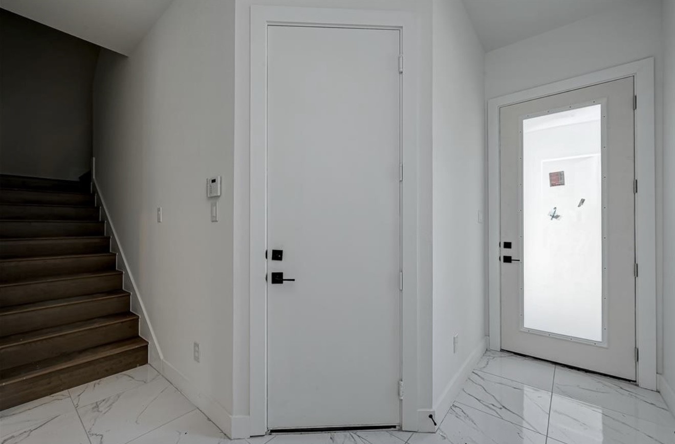 6127 West Montgomery Road Houston, TX 77091 - Photo 5 of 38 a view of a hallway with wooden floor and entryway