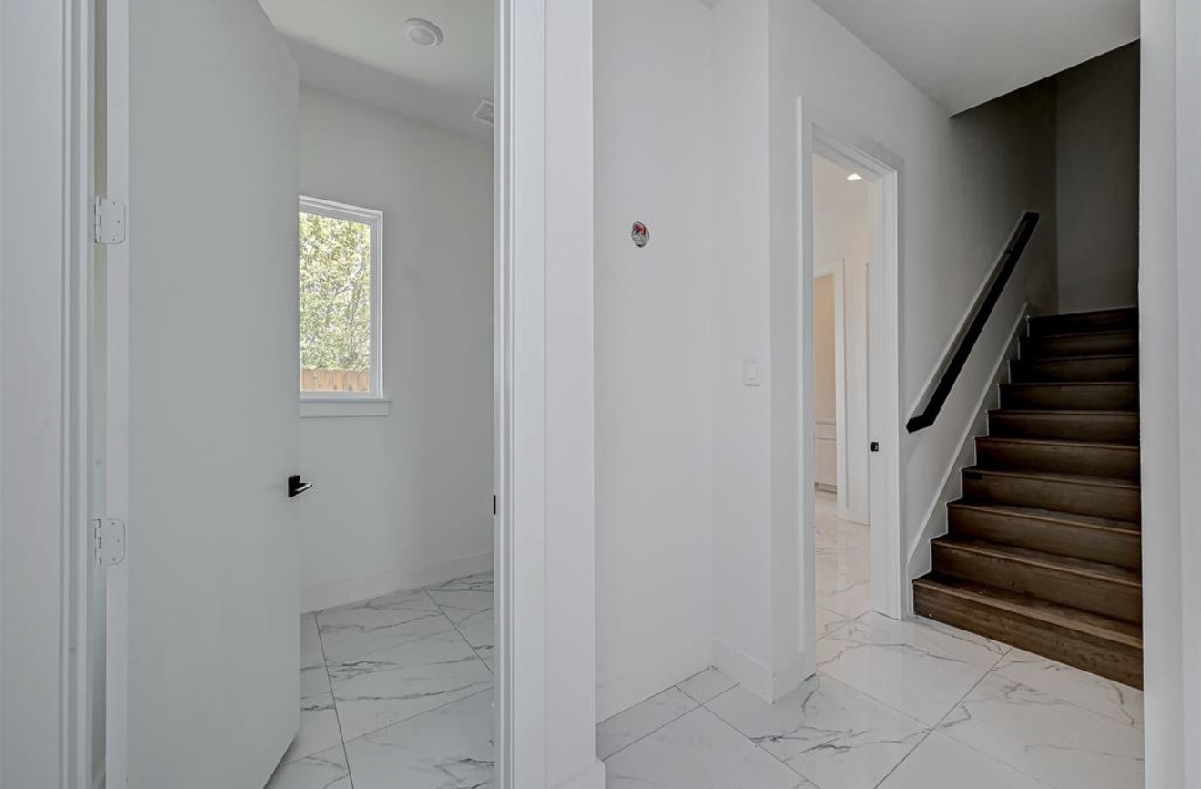 6127 West Montgomery Road Houston, TX 77091 - Photo 6 of 38 a view of entryway with stairs