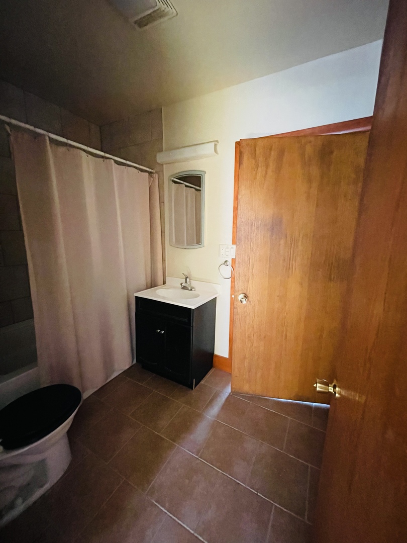 110 South Bloomington Road Grand Ridge, IL 61325 - Photo 8 of 49 a bathroom with a sink and a mirror