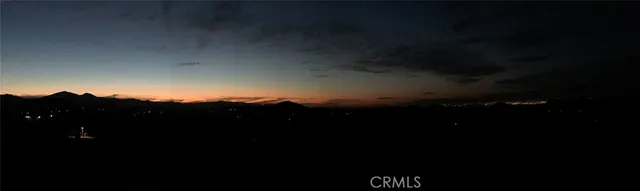 a view of sunset and a yard