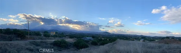 a view of a lot of trees and sunset