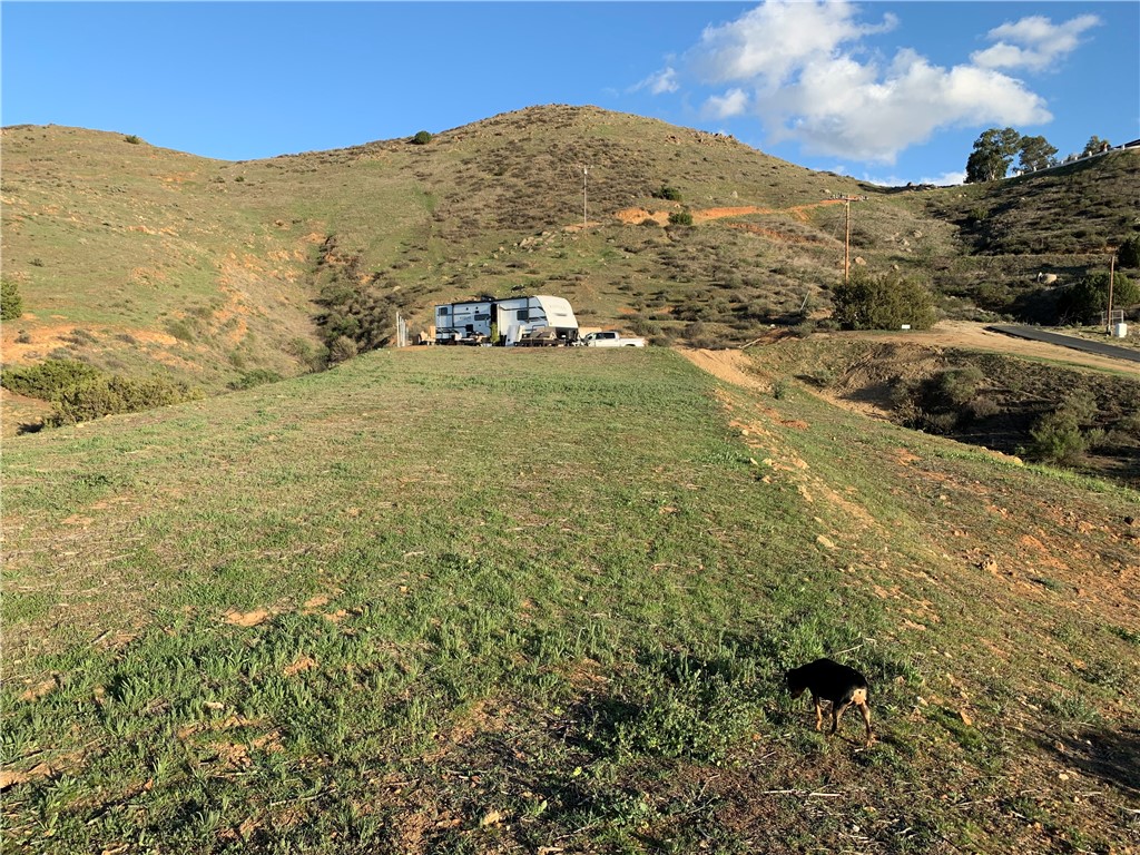 0 Niro Road Perris, CA 92570 - Photo 23 of 40 a view of a field with mountains in the background