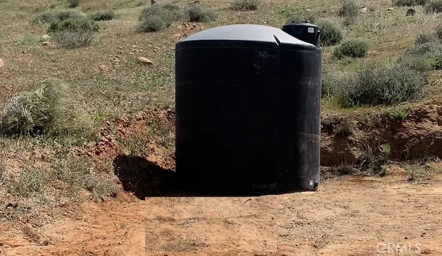 a view of a mountain in the distance in a field