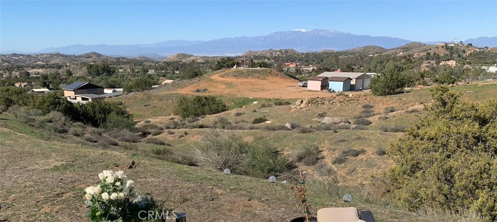 0 Niro Road Perris, CA 92570 - Photo 3 of 40 a view of a yard with mountain and wooden fence