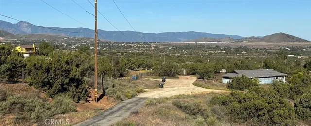 a view of a mountain with sitting area
