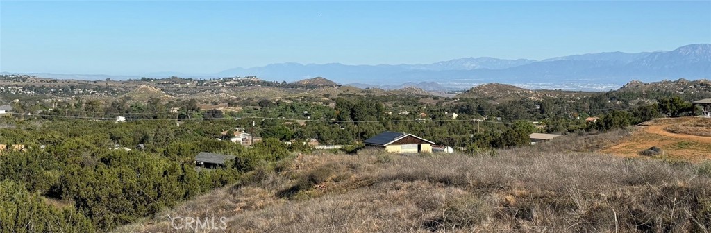 0 Niro Road Perris, CA 92570 - Photo 6 of 40 a view of a dry yard with mountains in the background