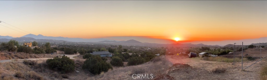 0 Niro Road Perris, CA 92570 - Photo 7 of 40 a view of a dry yard with mountains in the background