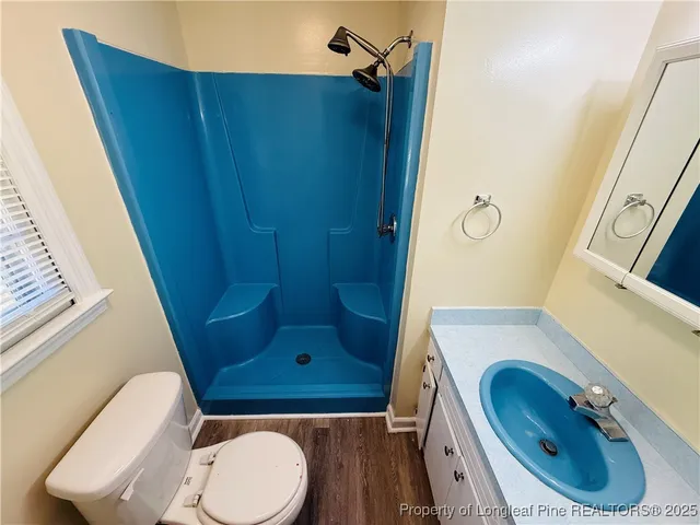 a bathroom with a toilet and a sink
