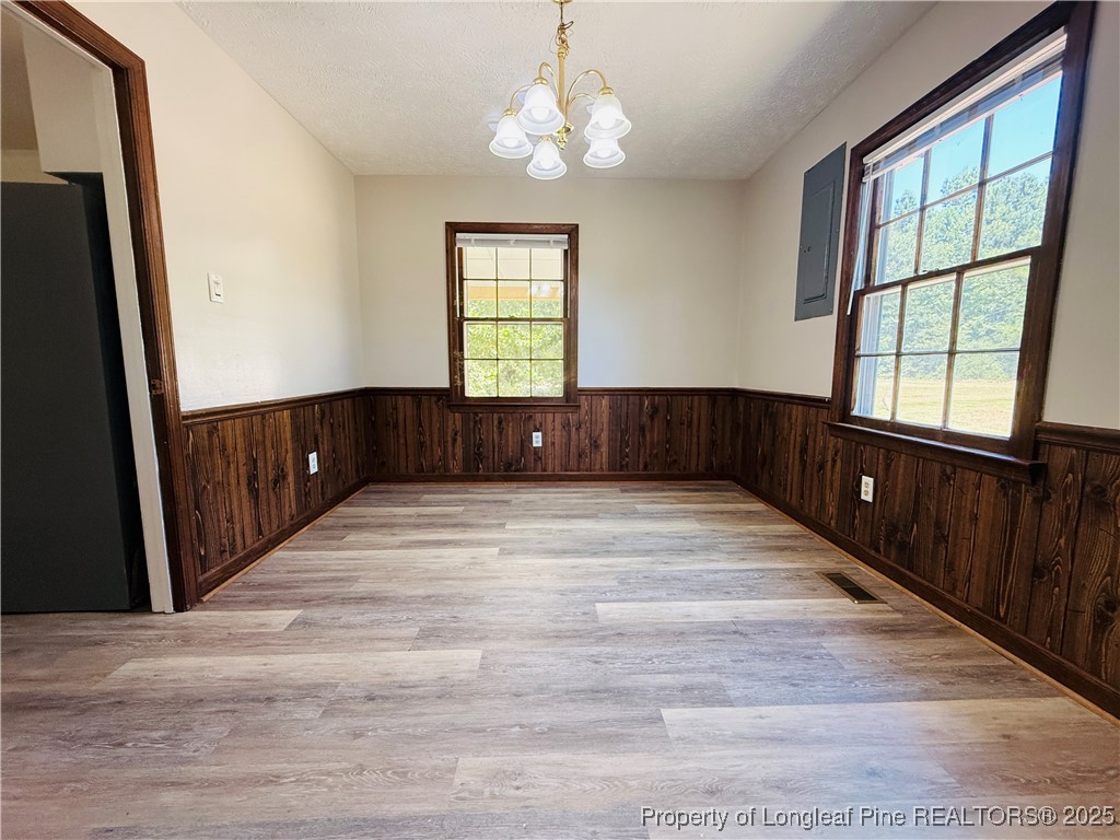 4355 Draughon Road Eastover, NC 28312 - Photo 5 of 20 a view of an entryway with wooden floor and windows