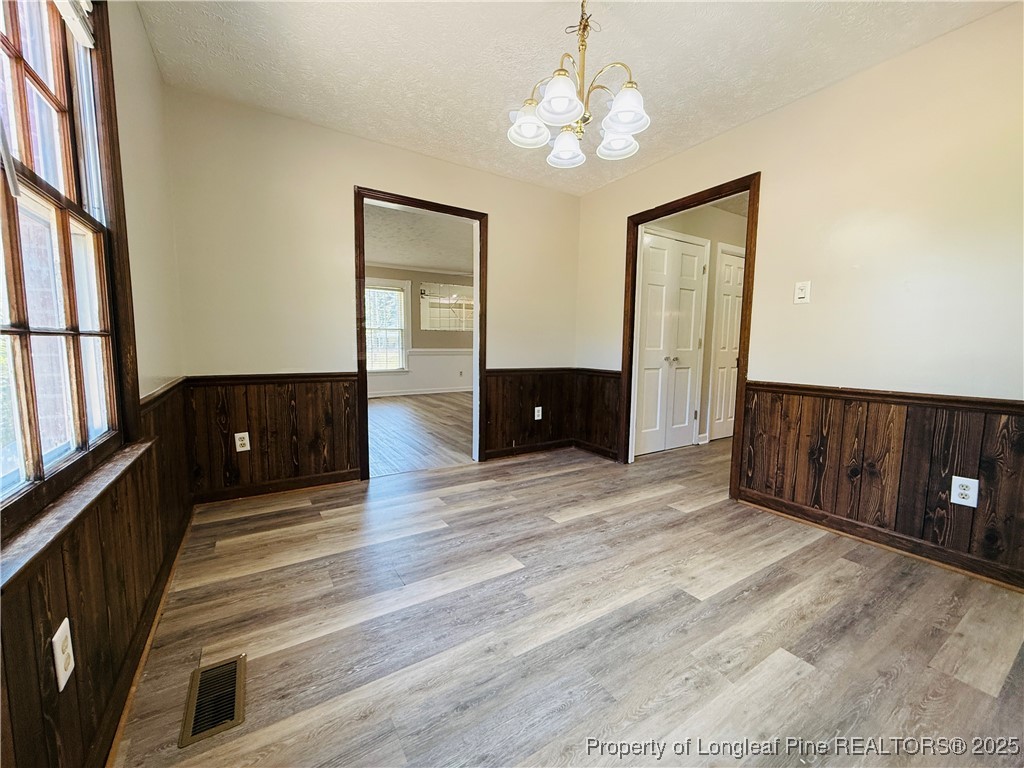 4355 Draughon Road Eastover, NC 28312 - Photo 6 of 20 a view of a livingroom with furniture and chandelier