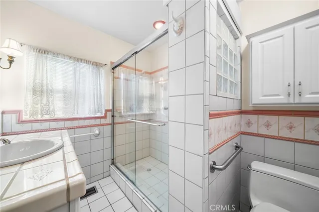 a bathroom with a bathtub and next to a window