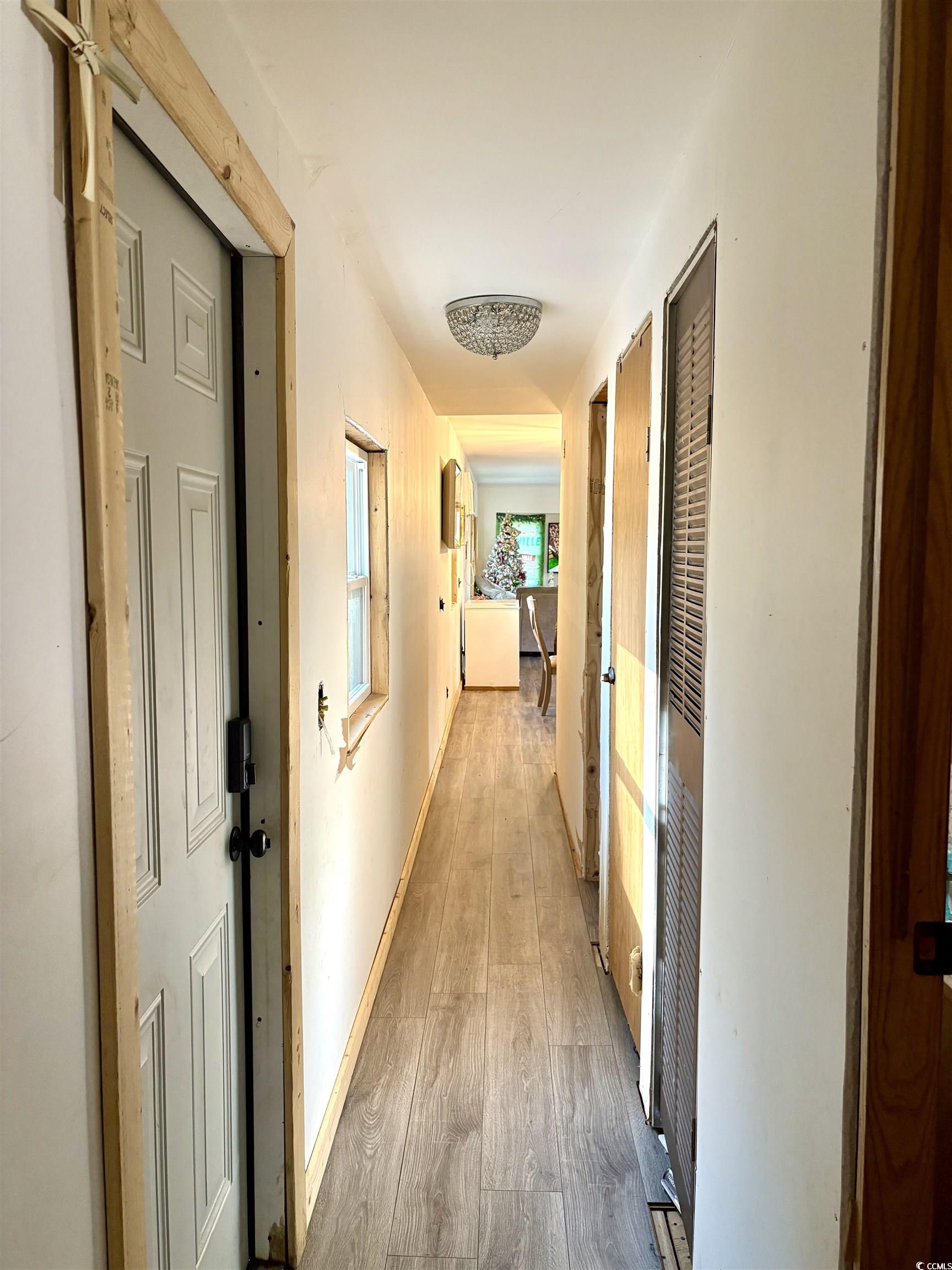 951 St John Road Galivants Ferry, SC 29544 - Photo 8 of 20 Hall with hardwood / wood-style flooring and baseboards