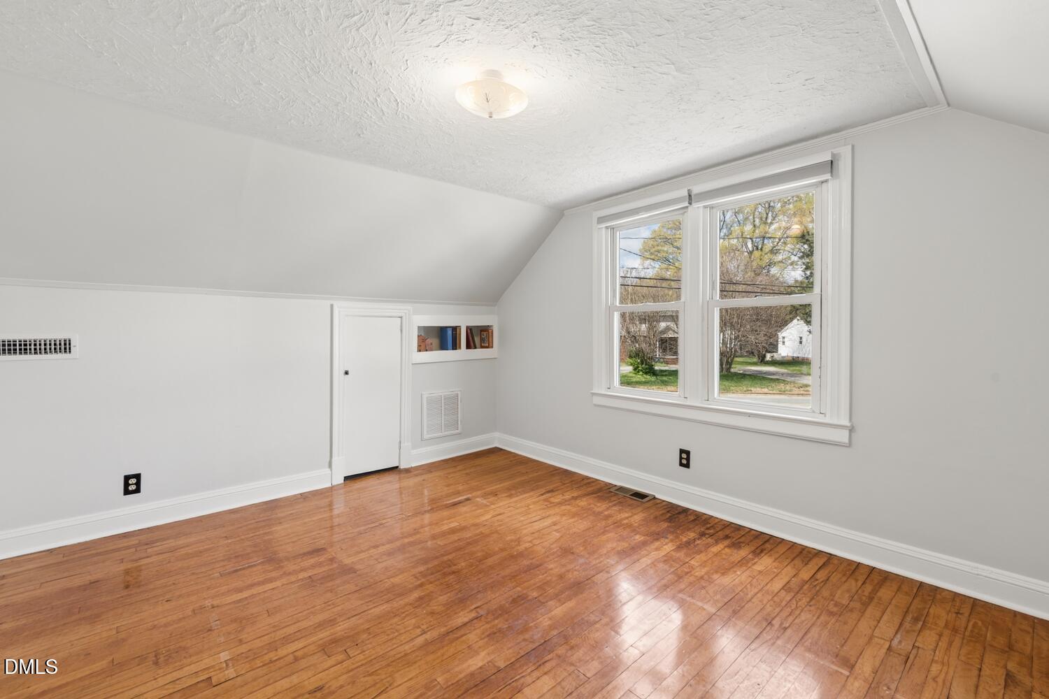 414 South Maple Street Graham, NC 27253 - Photo 24 of 42 wooden floor in an empty room with a window