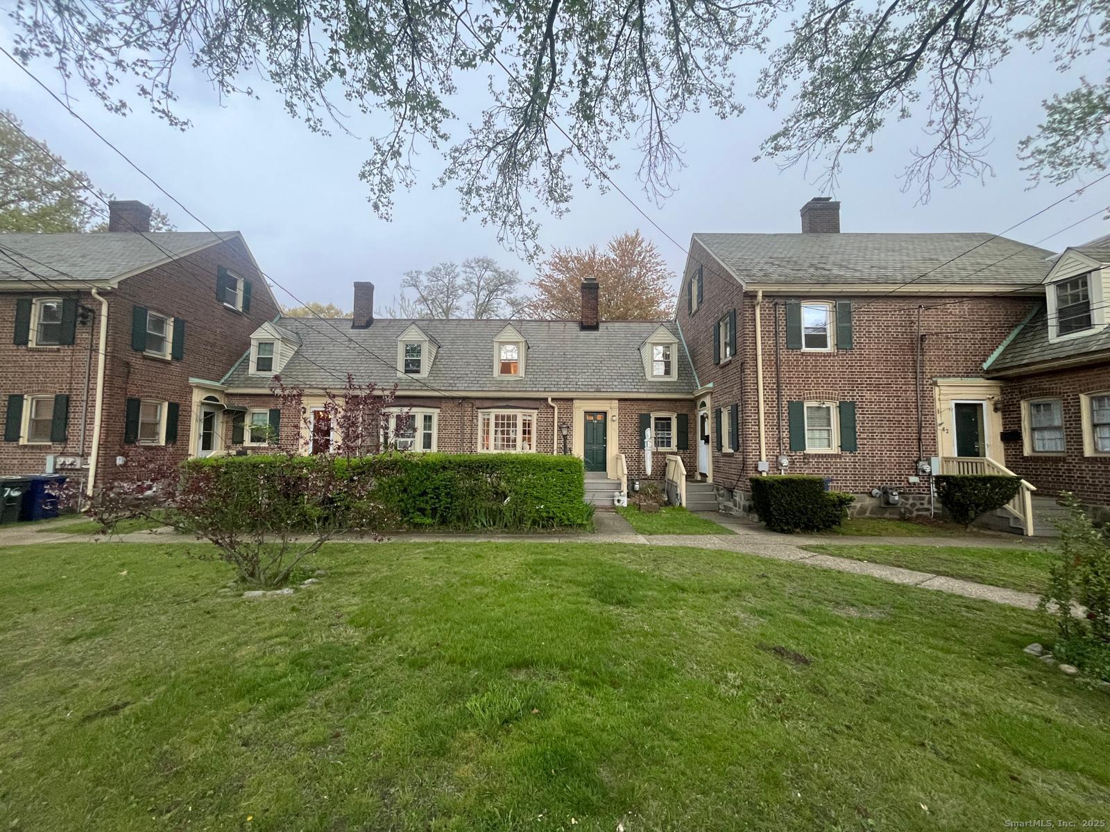 68 Cole Street Bridgeport, CT 06604 - Photo 3 of 31 a front view of a house with a yard
