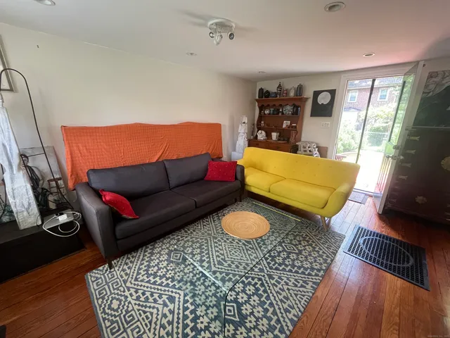 a living room with furniture and a rug