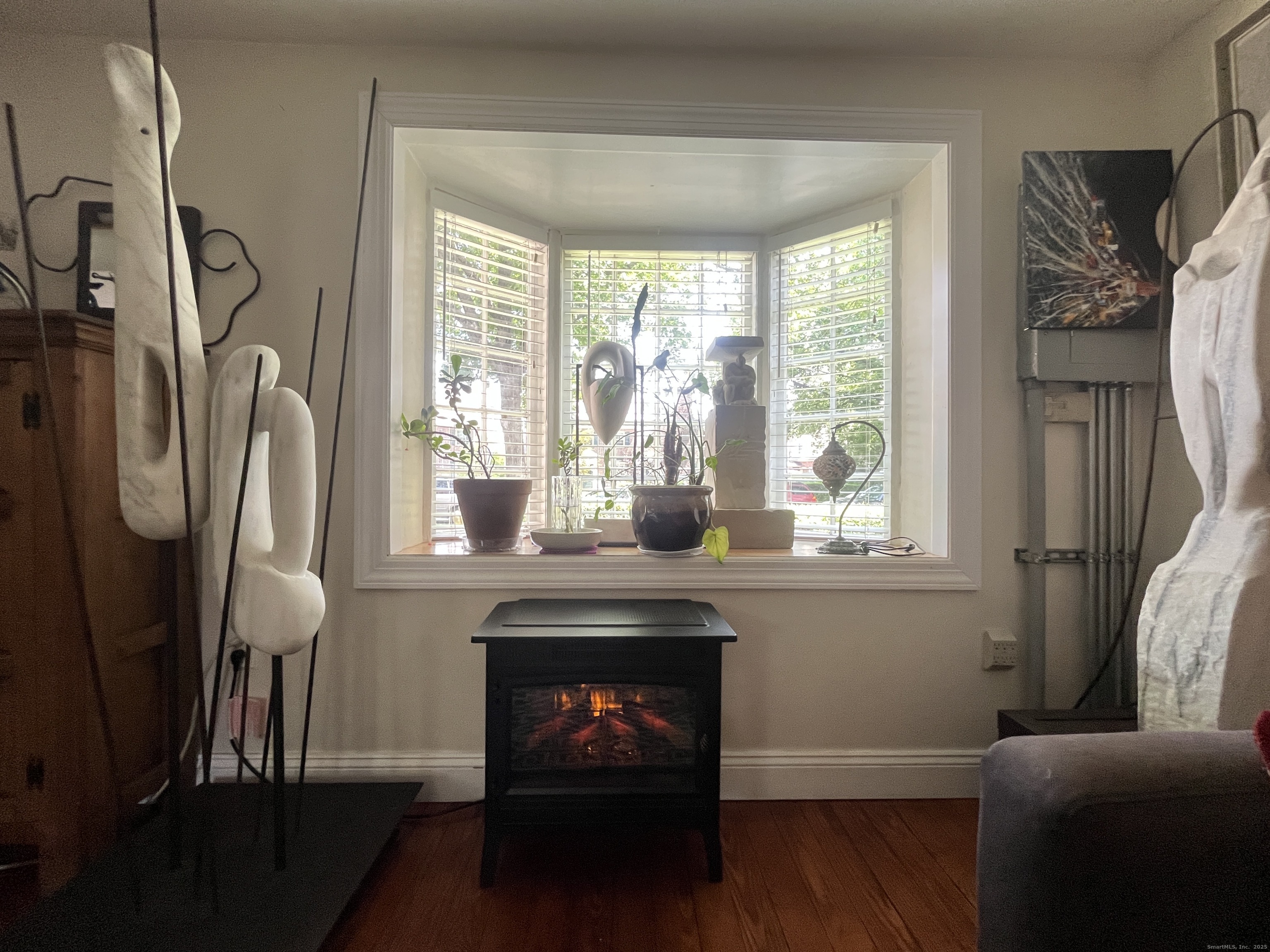 68 Cole Street Bridgeport, CT 06604 - Photo 6 of 31 a living room with furniture and a fireplace