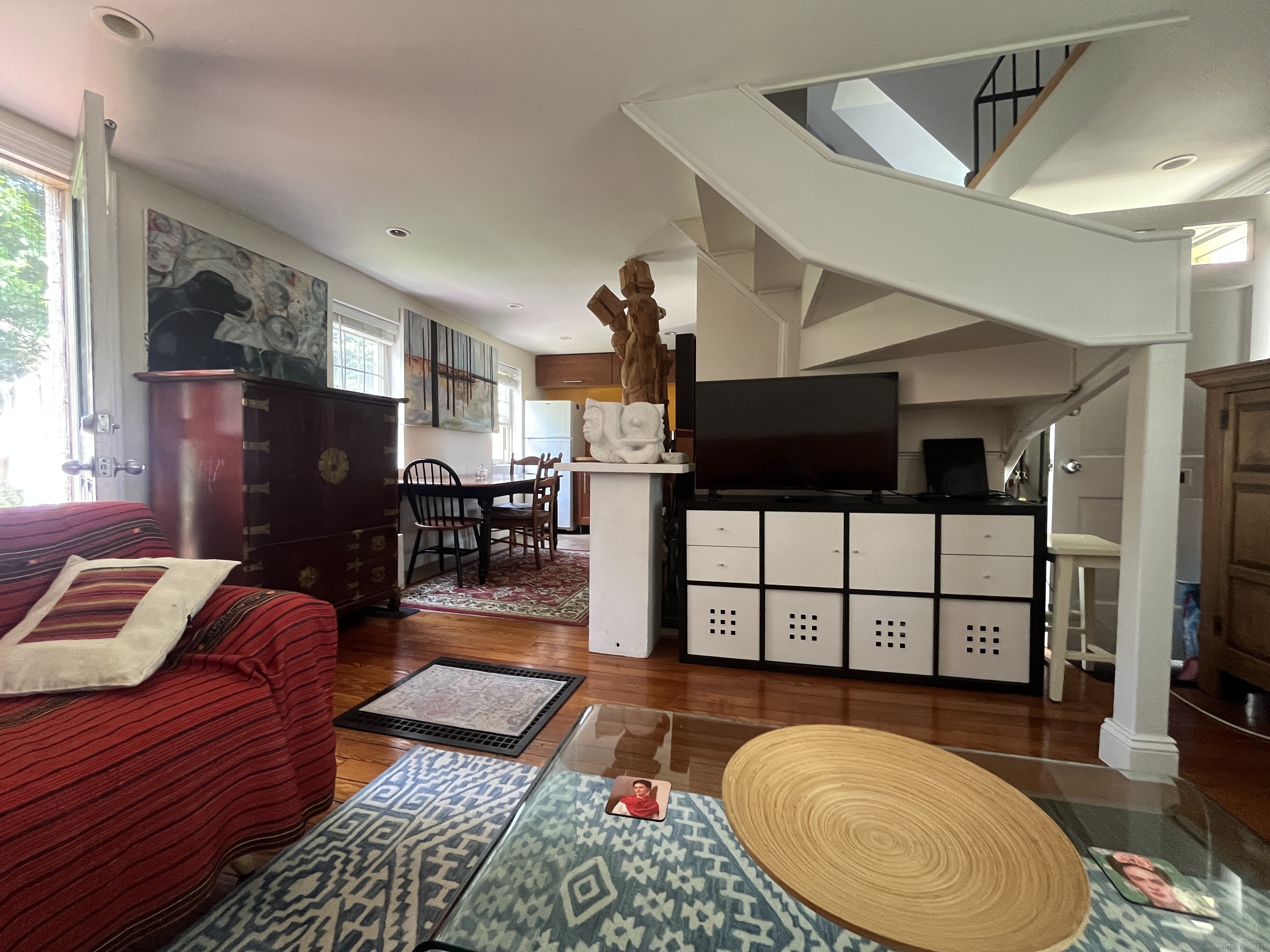 68 Cole Street Bridgeport, CT 06604 - Photo 7 of 31 a living room with furniture a rug and a floor to ceiling window