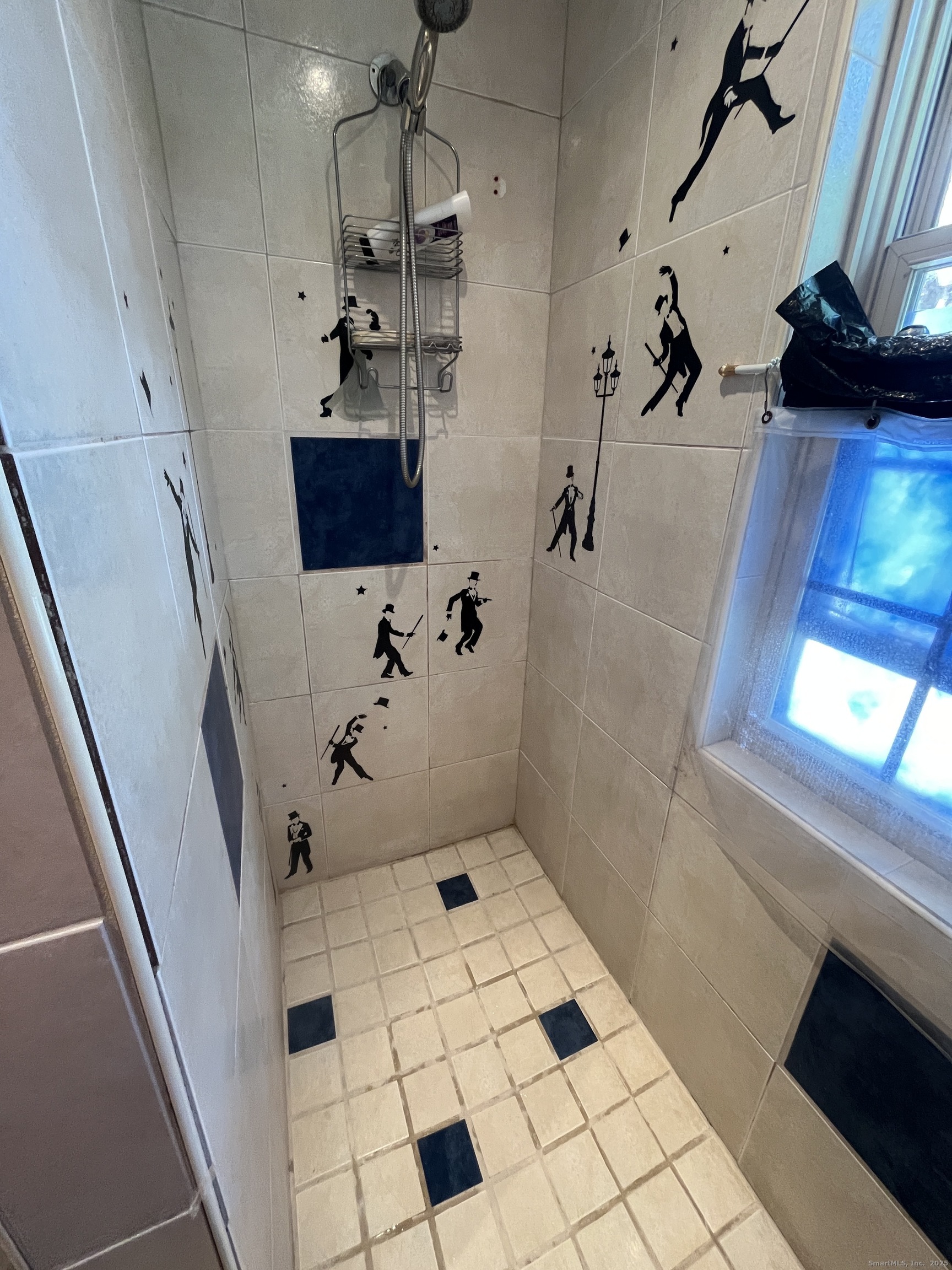 68 Cole Street Bridgeport, CT 06604 - Photo 10 of 31 a bathroom with a bathtub and a shower