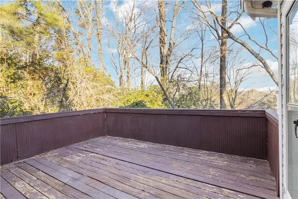 a view of balcony with wooden floor