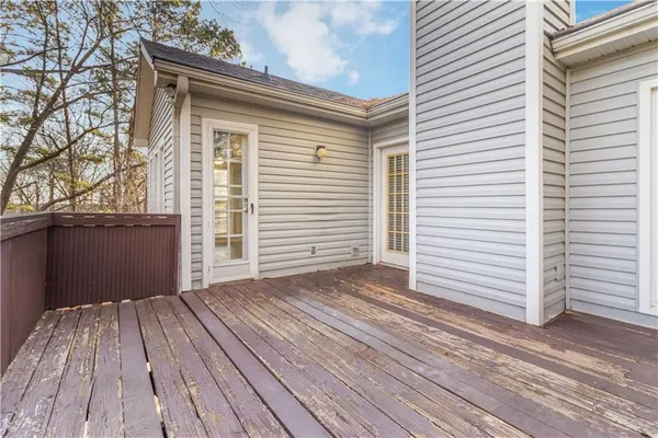 a view of a house with a wooden deck