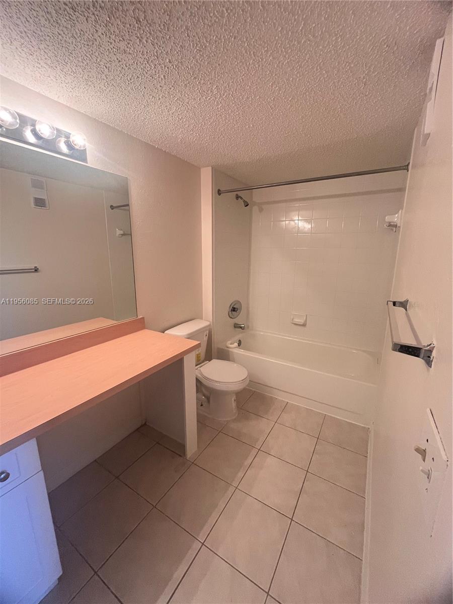 4035 West McNab Road, Unit F206 Pompano Beach, FL 33069 - Photo 10 of 20 a bathroom with a bathtub and a toilet