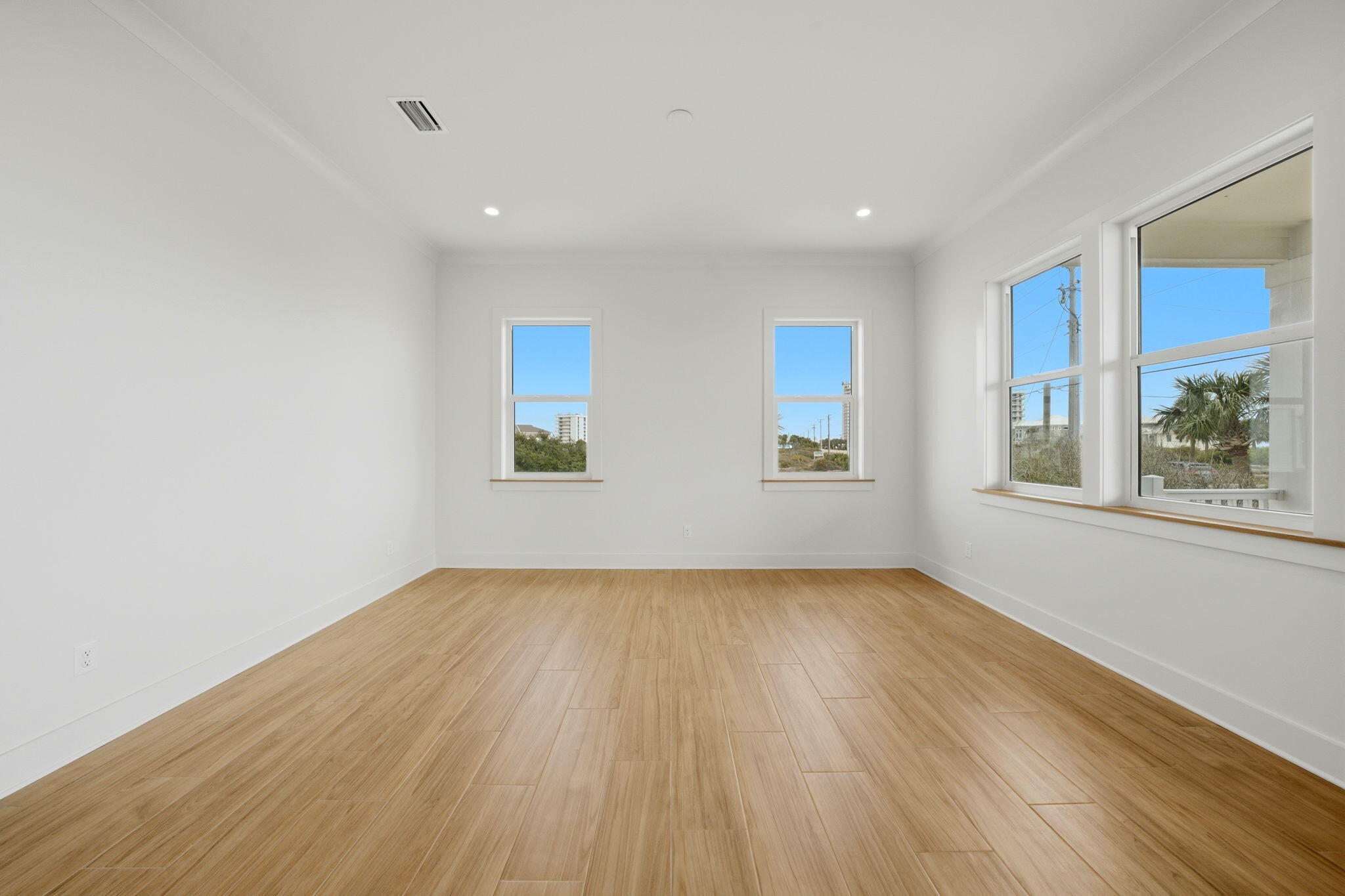 425 Gulfview Lane Perdido Key, FL 32507 - Photo 15 of 71 a view of an empty room with wooden floor and a window