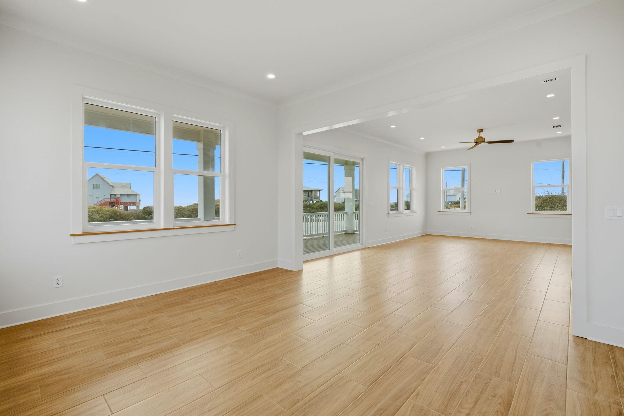 425 Gulfview Lane Perdido Key, FL 32507 - Photo 16 of 71 a view of empty room with wooden floor and windows