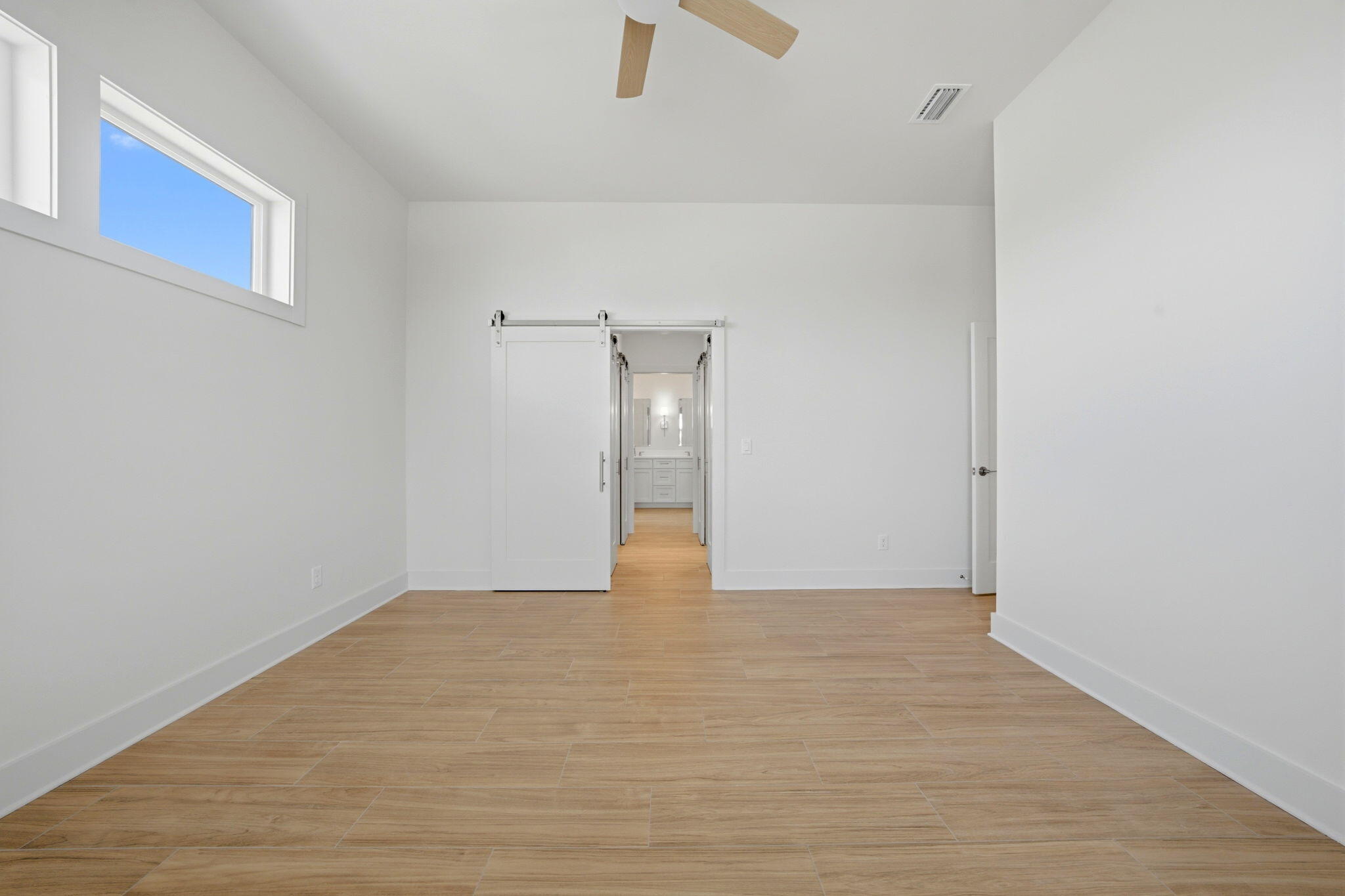 425 Gulfview Lane Perdido Key, FL 32507 - Photo 19 of 71 a view of an empty room with wooden floor