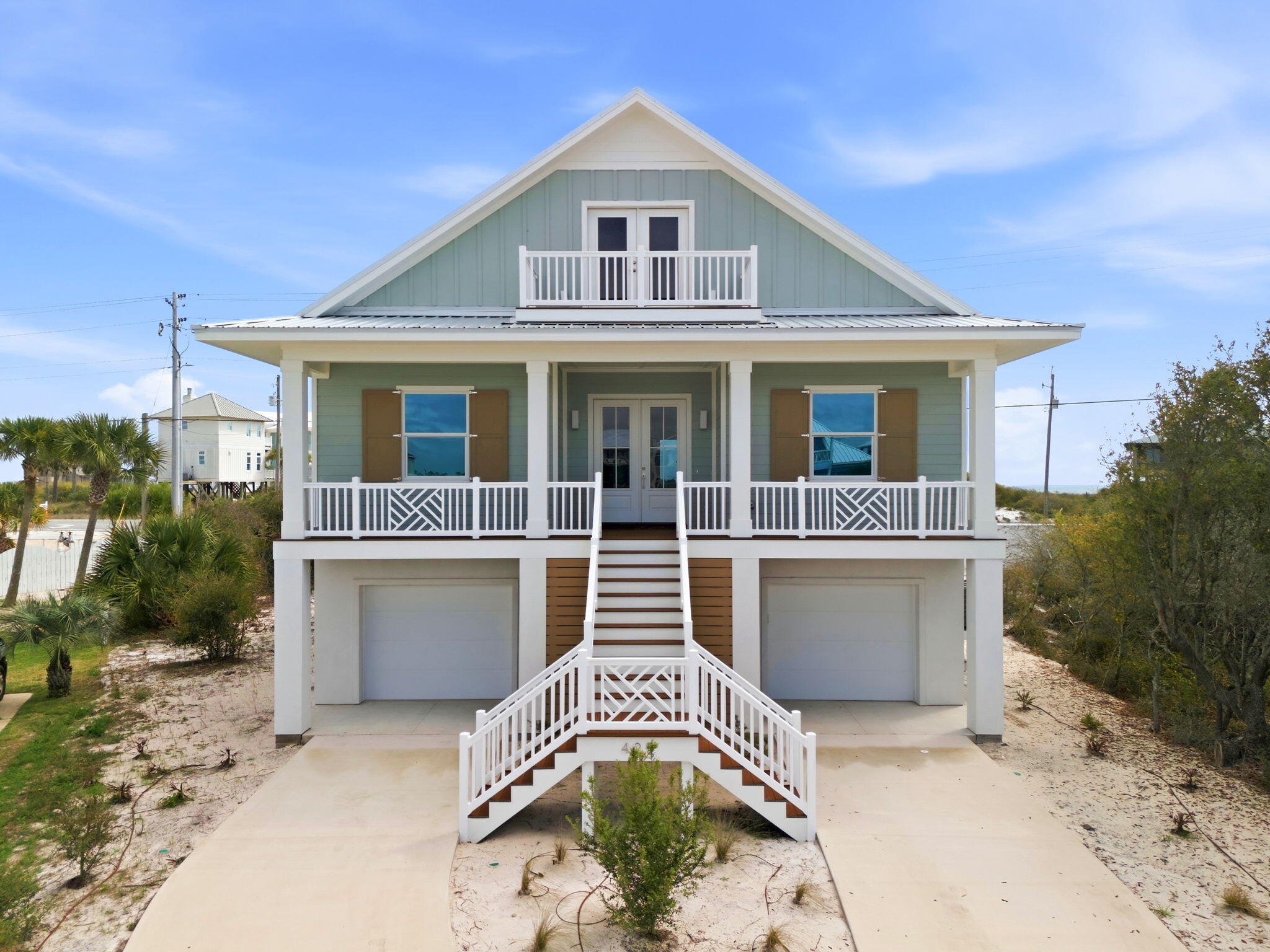 425 Gulfview Lane Perdido Key, FL 32507 - Photo 2 of 71 a front view of a house with a garden