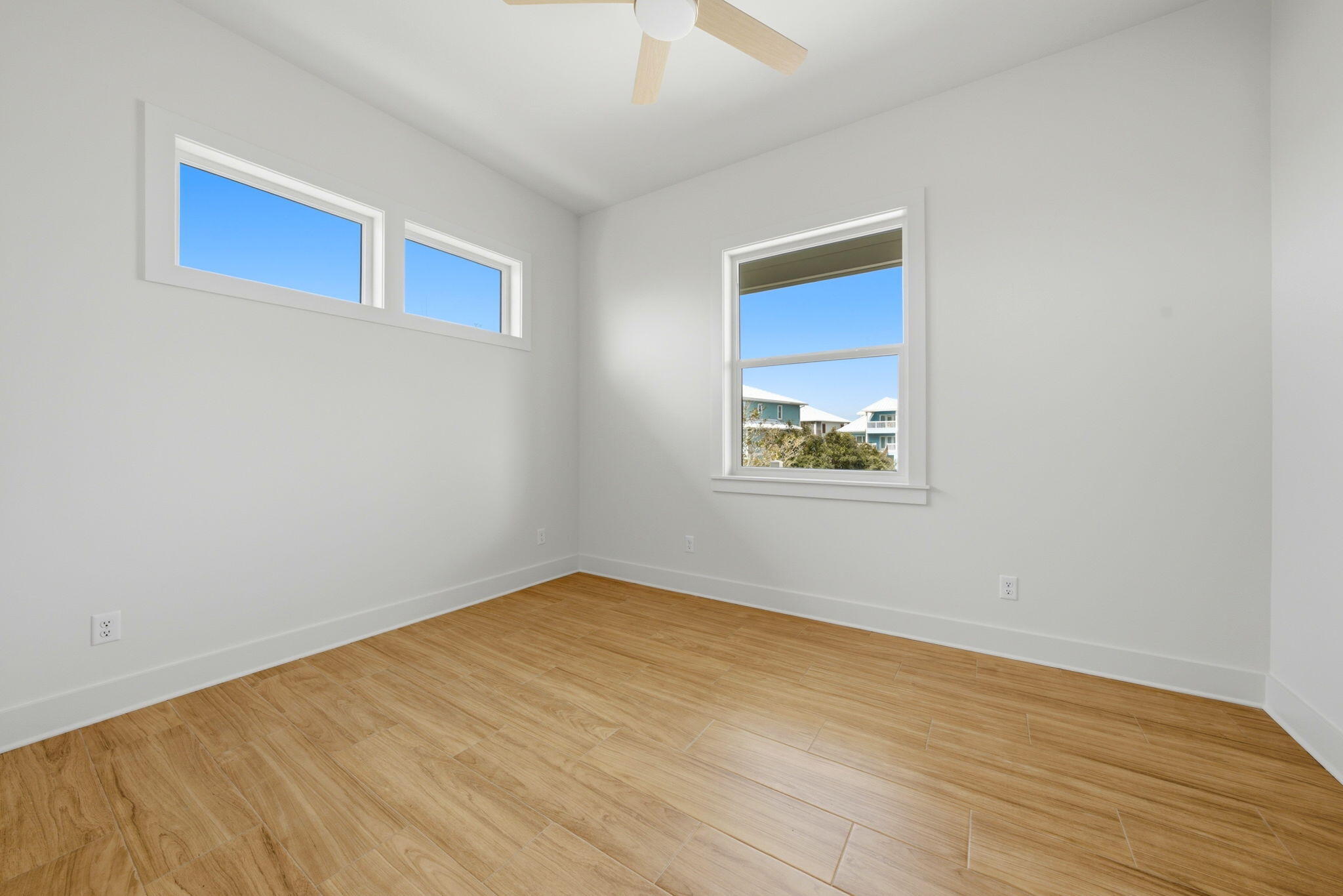 425 Gulfview Lane Perdido Key, FL 32507 - Photo 23 of 71 a view of an empty room with wooden floor and a window