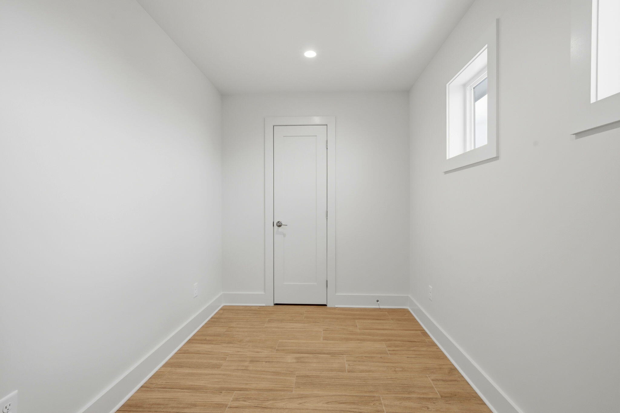 425 Gulfview Lane Perdido Key, FL 32507 - Photo 26 of 71 a view of a room with wooden floor and white walls