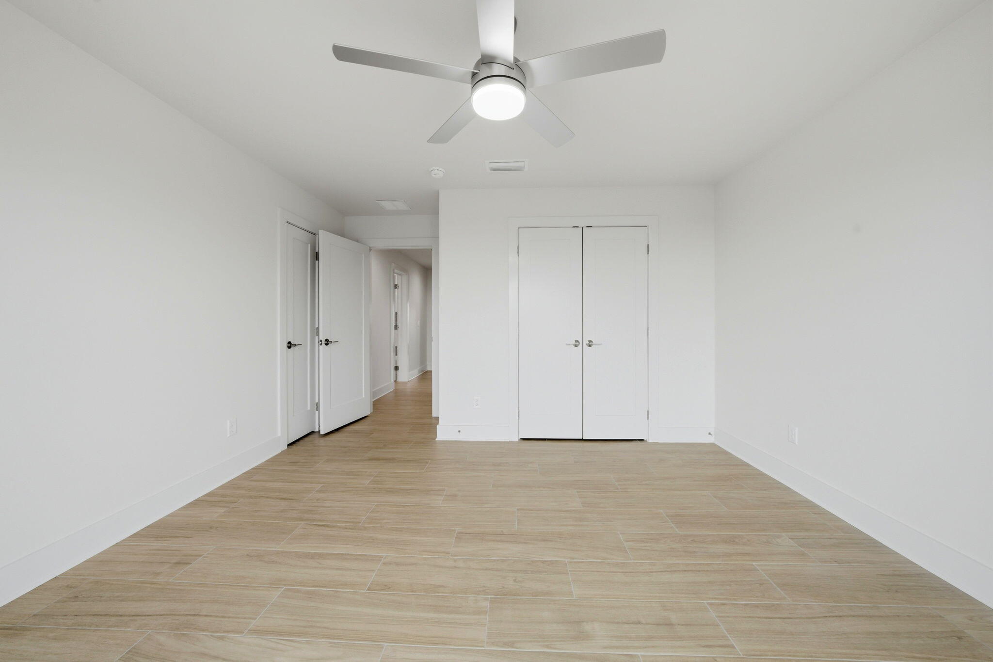 425 Gulfview Lane Perdido Key, FL 32507 - Photo 28 of 71 a view of an empty room with a ceiling fan