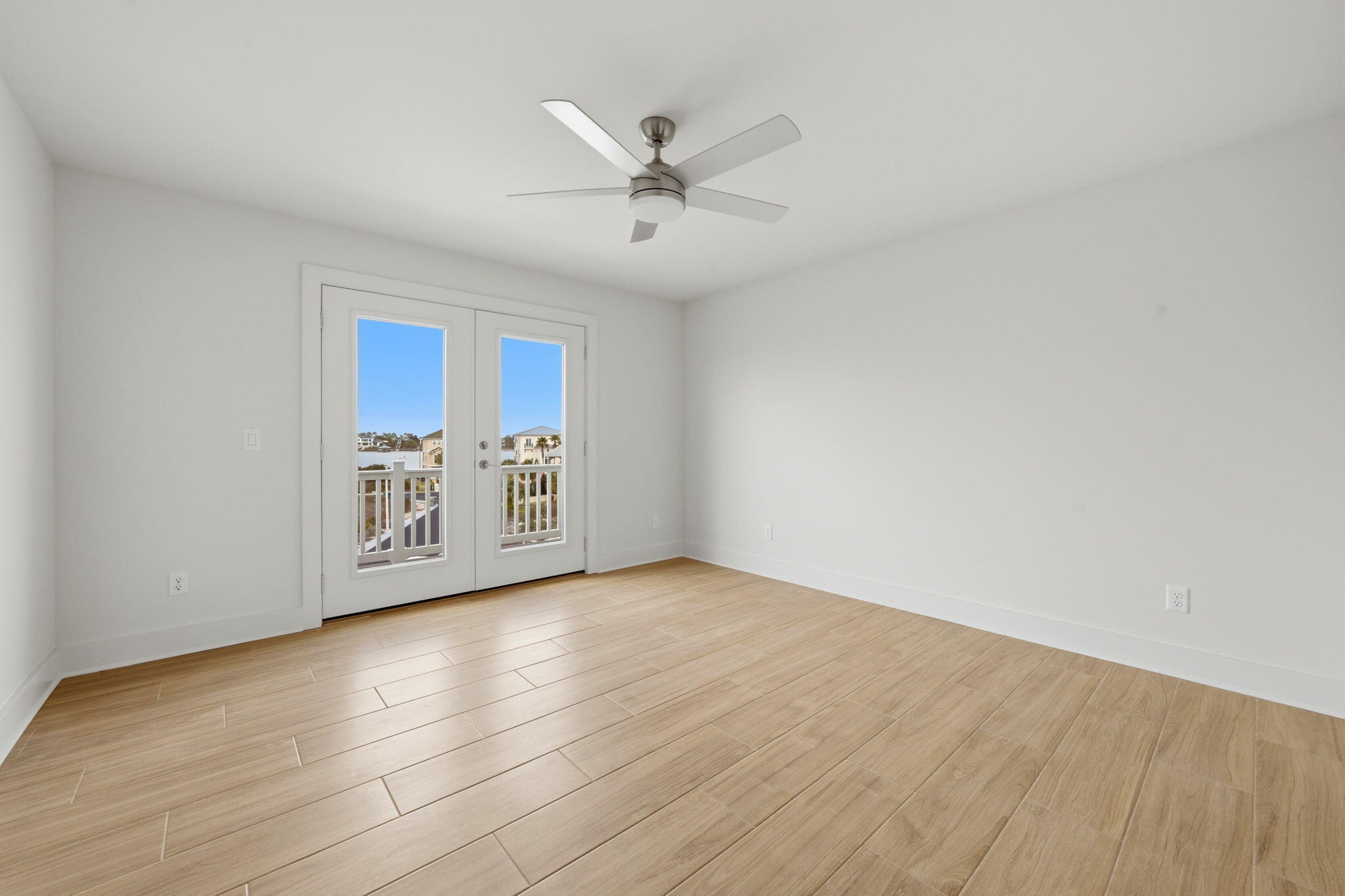 425 Gulfview Lane Perdido Key, FL 32507 - Photo 30 of 71 wooden floor in an empty room with a window