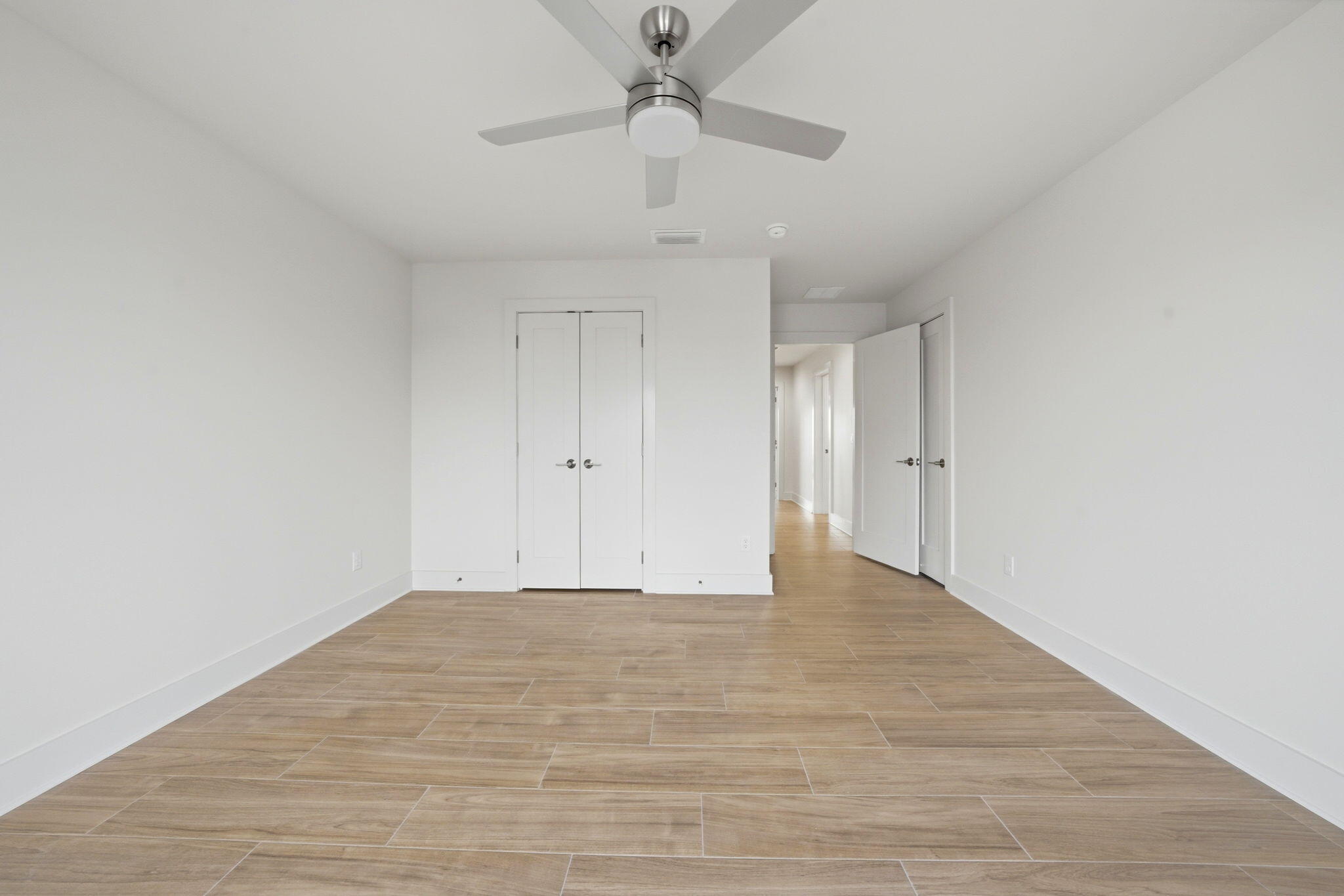425 Gulfview Lane Perdido Key, FL 32507 - Photo 31 of 71 a view of an empty room with a ceiling fan