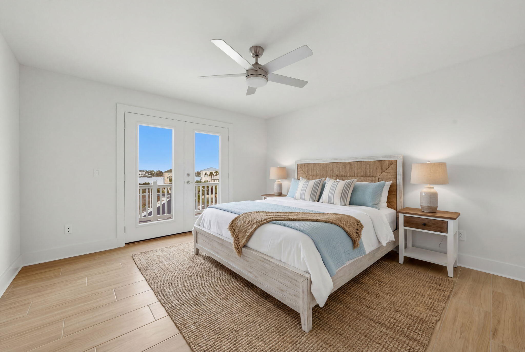 425 Gulfview Lane Perdido Key, FL 32507 - Photo 66 of 71 a spacious bedroom with a bed and a ceiling fan