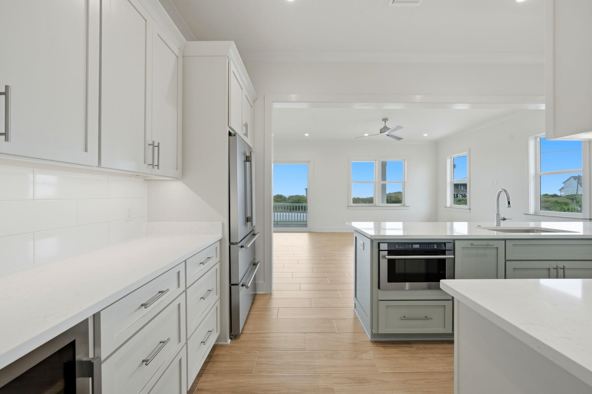 425 Gulfview Lane Perdido Key, FL 32507 - Photo 7 of 71 a kitchen with stainless steel appliances kitchen island granite countertop a sink and cabinets