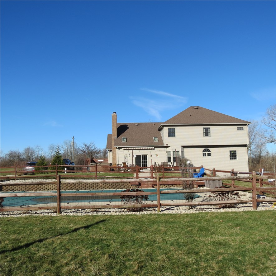 10160 Lochard Road Sidney, OH 45365 - Photo 37 of 41 This spacious home features a private backyard with a pool, ideal for outdoor gatherings.